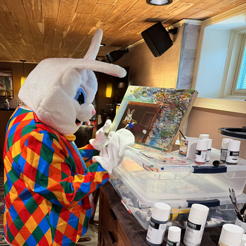 The Bloomin Fool in his private studio, dressed in character and working on an 8x8 inch acrylic self-portrait on wood panel.