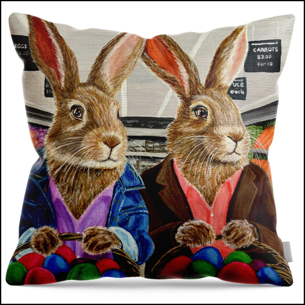A square throw pillow featuring a satirical painting of a male and a female rabbit inside a grocery store, pushing a cart and shopping for Easter eggs.