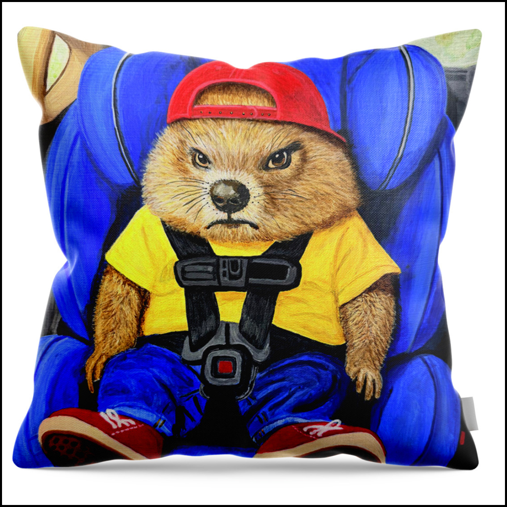 A square throw pillow featuring a satirical painting of an angry groundhog wearing jeans, a yellow shirt, and a baseball cap, buckled securely into a child safety seat in the back of a car.