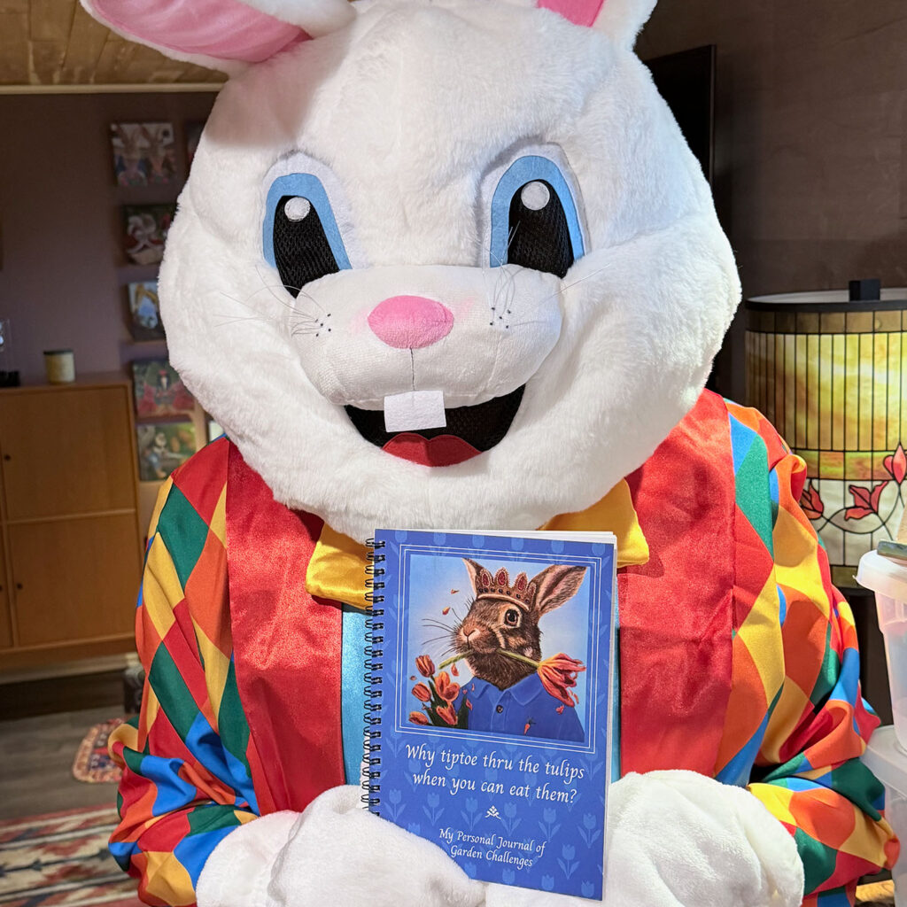The Bloomin Fool holding the Rabbit Eating Tulips 1.0 notebook to inspect print resolution.